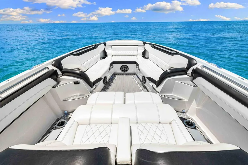 Rod's Jewel Yacht Photos Pics Luxurious 2017 Nor-Tech 450SS boat interior with white seating on open water.