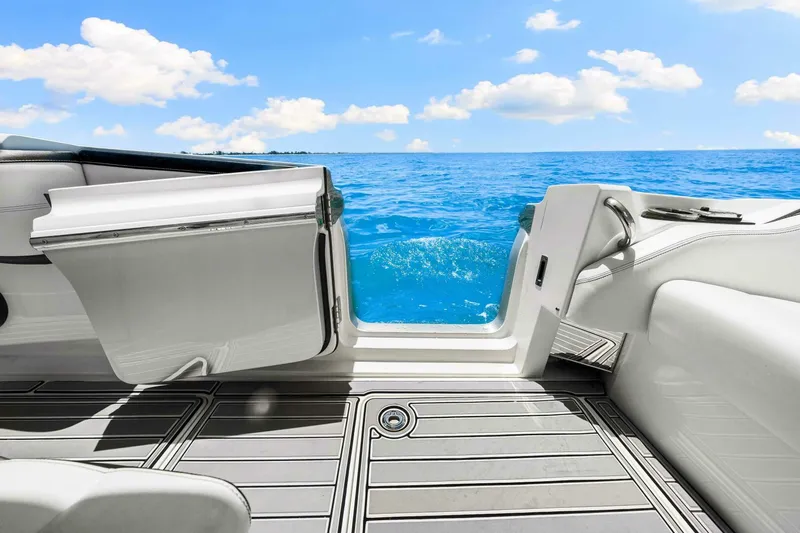 Rod's Jewel Yacht Photos Pics 2017 Nor-Tech 450SS boat interior with open door, ocean view, and blue sky.