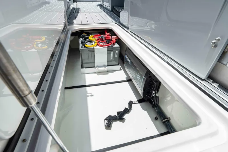 Rod's Jewel Yacht Photos Pics 2017 Nor-Tech 450SS boat battery compartment with wiring and storage space.