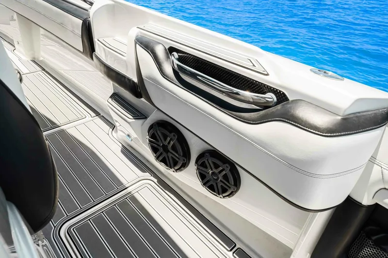 Rod's Jewel Yacht Photos Pics 2017 Nor-Tech 450SS boat interior with sleek seating and marine speakers.
