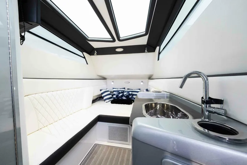 Rod's Jewel Yacht Photos Pics Interior of 2017 Nor-Tech 450SS boat with modern seating and kitchenette.