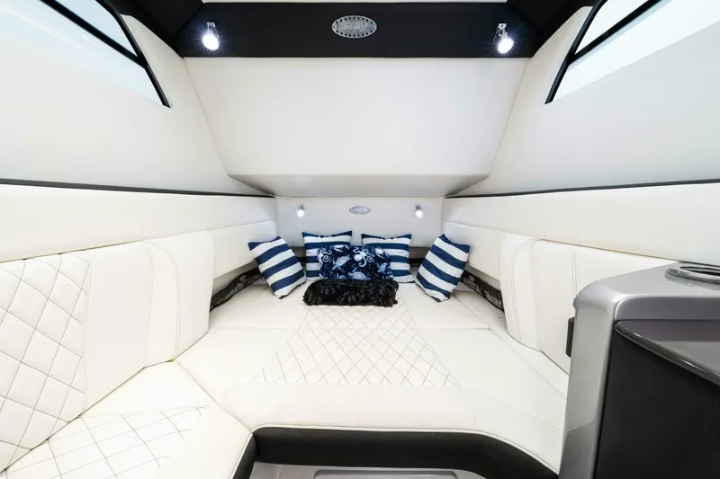 Rod's Jewel Yacht Photos Pics Luxurious interior of 2017 Nor-Tech 450SS boat with plush seating and decorative pillows.