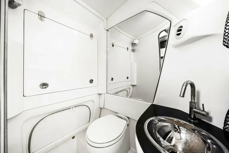 Rod's Jewel Yacht Photos Pics Luxurious bathroom interior of 2017 Nor-Tech 450SS boat, featuring sleek design and modern fixtures.