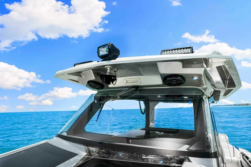 Rod's Jewel Yacht Photos Pics 2017 Nor-Tech 450SS boat on blue ocean under clear sky.