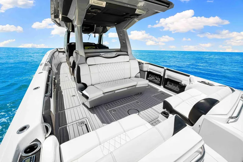 Rod's Jewel Yacht Photos Pics 2017 Nor-Tech 450SS luxury boat interior with white seating, on a clear blue ocean.