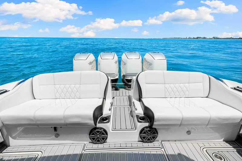 Rod's Jewel Yacht Photos Pics 2017 Nor-Tech 450SS boat interior with white seating and ocean backdrop.