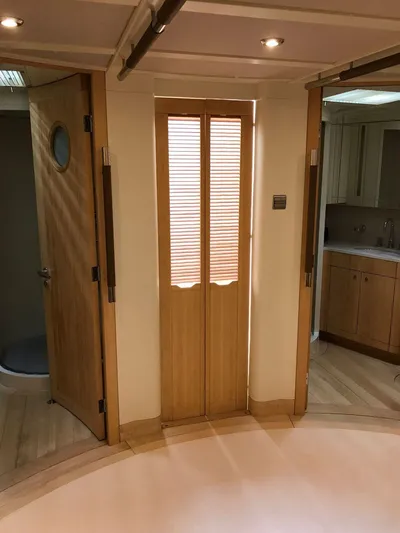  Yacht Photos Pics Interior of CNB 117 yacht, featuring wooden doors and modern lighting, 2006 model.