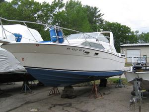 1983 Bayliner 2850 Contessa boat on stands, ready for maintenance.