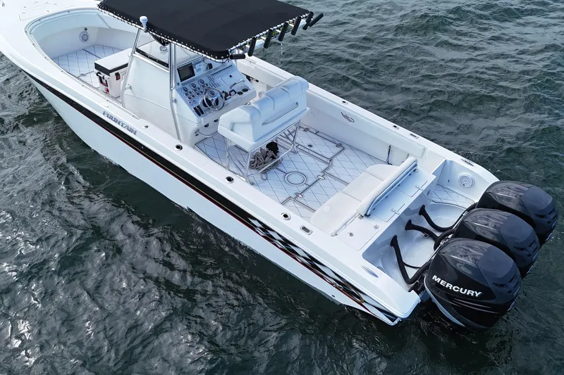  Yacht Photos Pics 2005 Fountain 34 Sportfish CC Open Bow with triple Mercury engines on water.