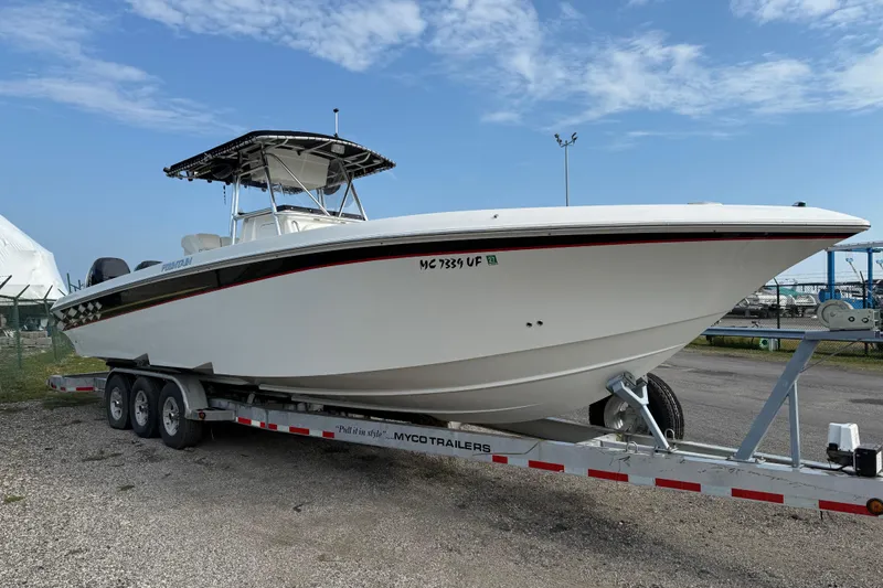  Yacht Photos Pics 2005 Fountain 34 Sportfish CC Open Bow on trailer, parked outdoors under blue sky.