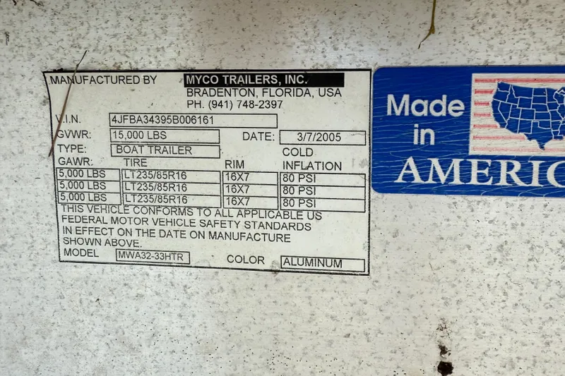  Yacht Photos Pics Label on Myco Trailers boat trailer, 2005, with specifications and "Made in America" sticker.