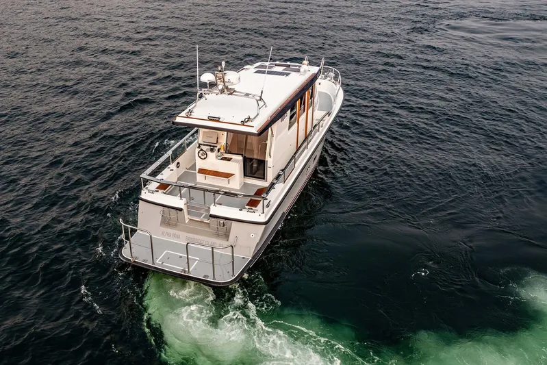  Yacht Photos Pics 2019 Targa 35 boat cruising on open water, aerial view.