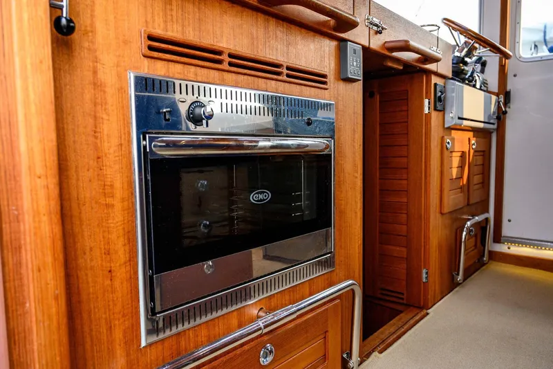  Yacht Photos Pics 2019 Targa 35 yacht interior with wooden cabinetry and built-in oven.