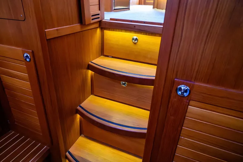  Yacht Photos Pics Wooden interior stairs with ambient lighting on a 2019 Targa 35 boat.
