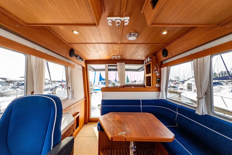  Yacht Photos Pics Interior of 2019 Targa 35 boat with wooden finish and blue seating.