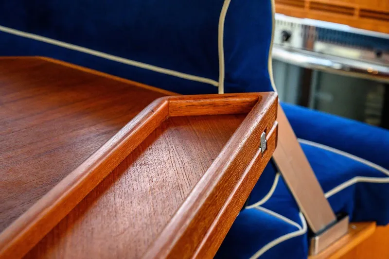  Yacht Photos Pics Luxurious wooden interior detail of a 2019 Targa 35 boat with blue upholstery.