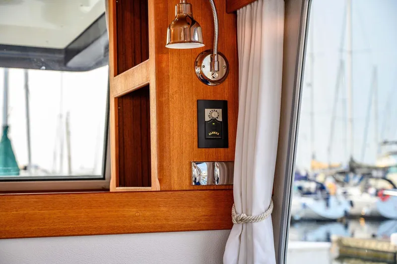  Yacht Photos Pics Interior of 2019 Targa 35 boat with wooden paneling and marina view.