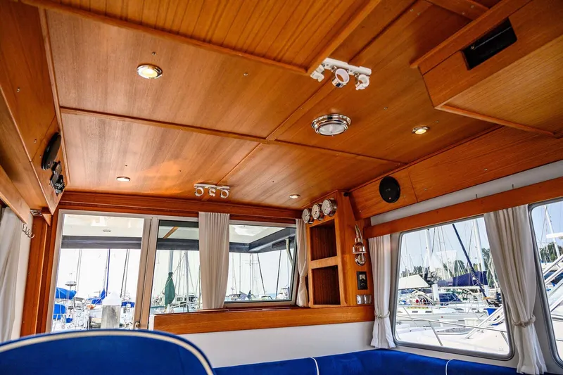  Yacht Photos Pics Interior of 2019 Targa 35 boat with wooden ceiling and blue seating.