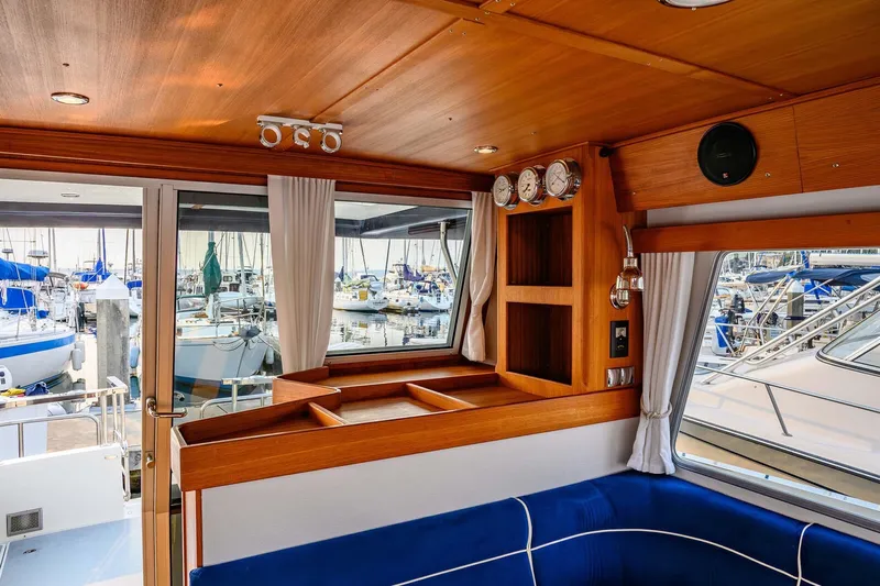  Yacht Photos Pics Interior of 2019 Targa 35 boat with wooden finish and marina view.