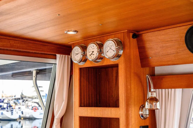  Yacht Photos Pics Interior of 2019 Targa 35 boat with wooden finish and nautical instruments.