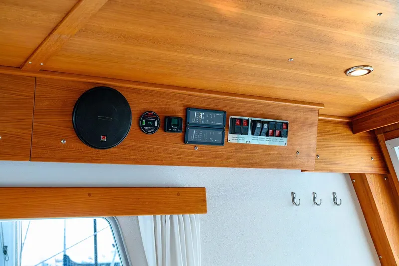  Yacht Photos Pics Wooden interior of 2019 Targa 35 boat with control panel and speaker.