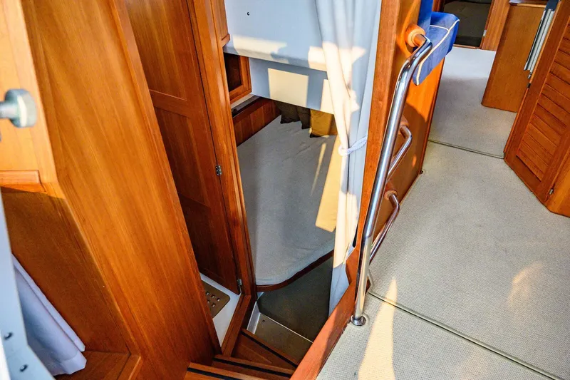  Yacht Photos Pics Interior of 2019 Targa 35 boat, featuring wooden finishes and a cozy cabin space.