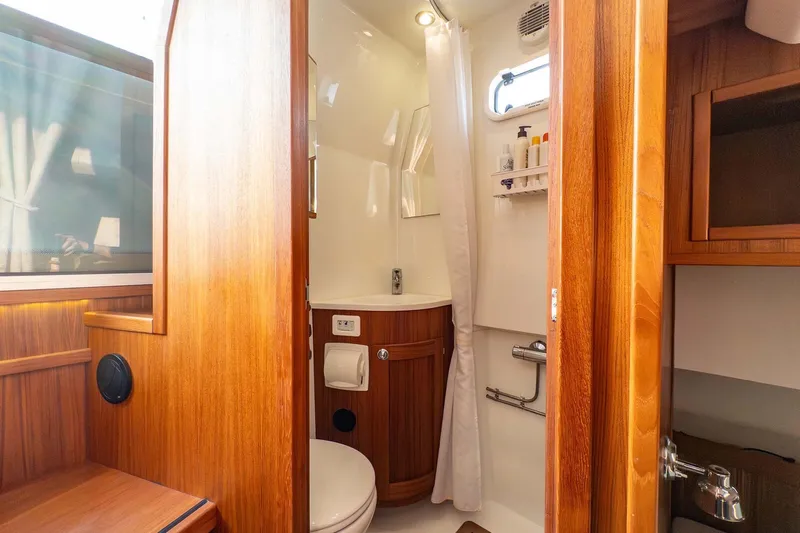  Yacht Photos Pics Luxurious wooden interior of 2019 Targa 35 yacht bathroom with modern amenities.