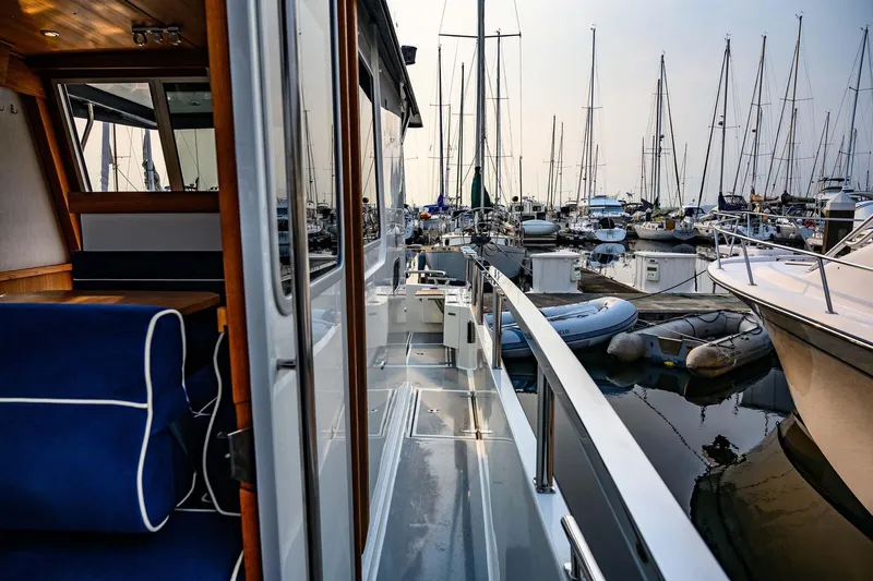  Yacht Photos Pics 2019 Targa 35 yacht docked in a marina, surrounded by sailboats.