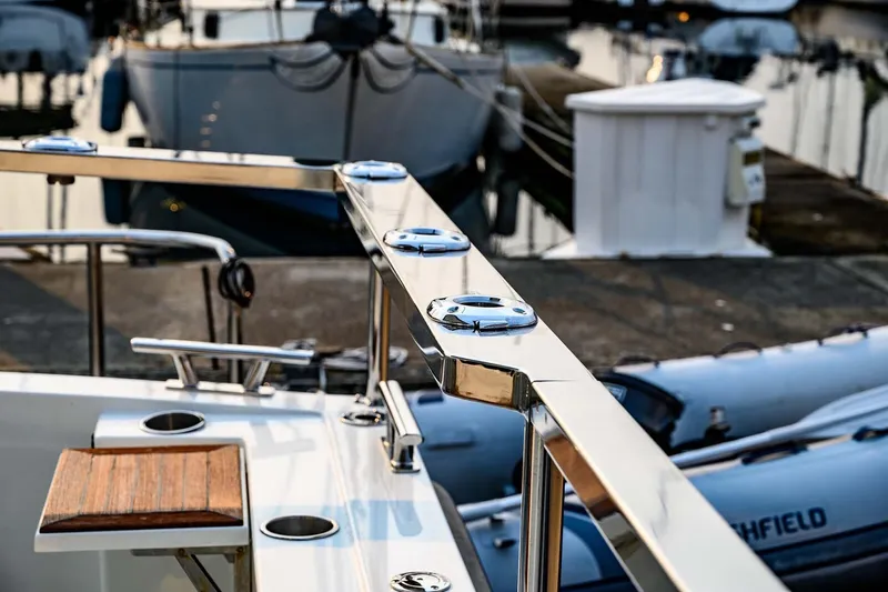  Yacht Photos Pics Polished railing on a 2019 Targa 35 boat docked at a marina.
