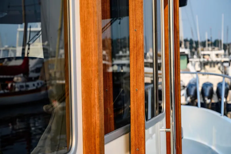  Yacht Photos Pics Close-up of 2019 Targa 35 boat with wooden details at marina.