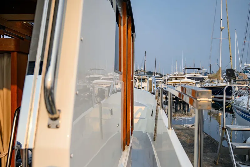  Yacht Photos Pics 2019 Targa 35 boat docked at marina, reflecting nearby vessels.