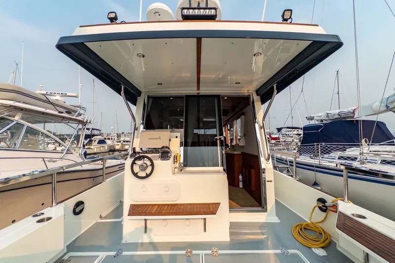  Yacht Photos Pics 2019 Targa 35 boat interior with helm, docked in marina.