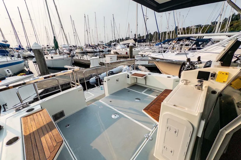  Yacht Photos Pics 2019 Targa 35 boat docked at marina, surrounded by sailboats and yachts.