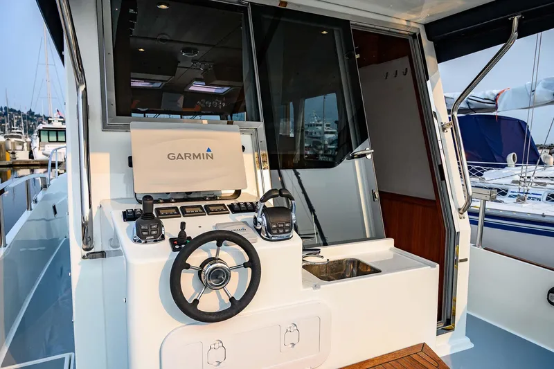  Yacht Photos Pics 2019 Targa 35 boat helm with Garmin navigation system and modern controls.