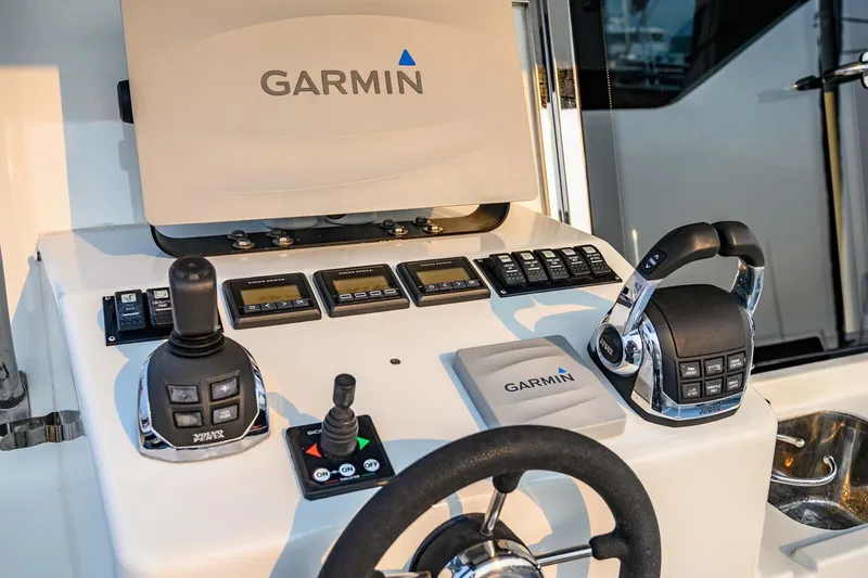  Yacht Photos Pics Control panel of a 2019 Targa 35 boat featuring Garmin navigation equipment.