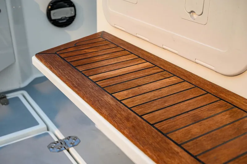  Yacht Photos Pics Wooden deck detail on 2019 Targa 35 boat, showcasing elegant craftsmanship.