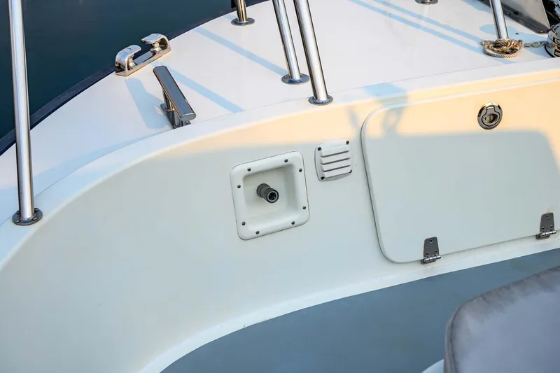  Yacht Photos Pics 2019 Targa 35 boat deck with railing and storage compartment.