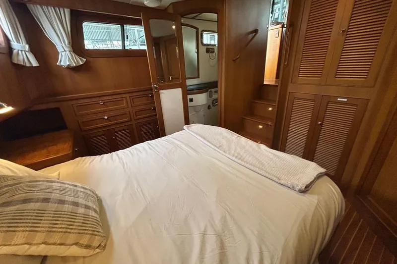 Kairos Yacht Photos Pics Cozy cabin interior of 2005 Selene 36 yacht with wooden furnishings.