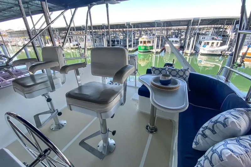 Kairos Yacht Photos Pics Flybridge of 2005 Selene 36 yacht with seating and marina view.