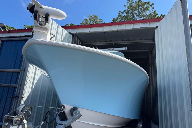  Yacht Photos Pics 2024 SeaVee 32Z boat in storage, featuring a sleek blue hull and modern design.