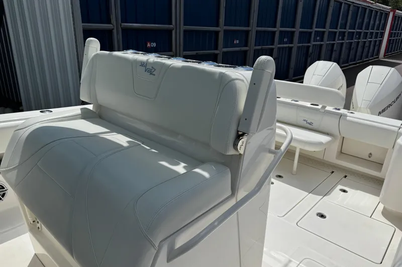  Yacht Photos Pics 2024 SeaVee 32Z boat interior with white seating and Mercury engines.