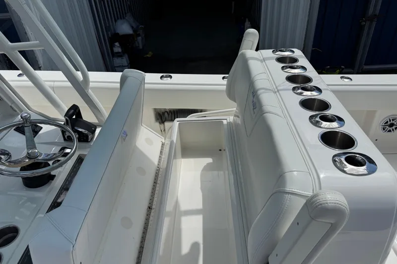  Yacht Photos Pics 2024 SeaVee 32Z boat interior with steering wheel and cup holders.
