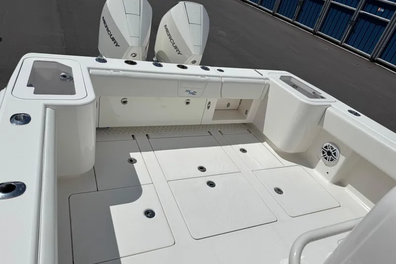  Yacht Photos Pics 2024 SeaVee 32Z boat deck with Mercury engines, spacious layout, and storage compartments.