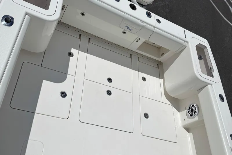  Yacht Photos Pics 2024 SeaVee 32Z boat deck with storage compartments and speaker.