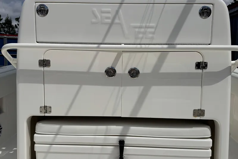  Yacht Photos Pics 2024 SeaVee 32Z boat storage compartment with sleek white finish and secure latches.