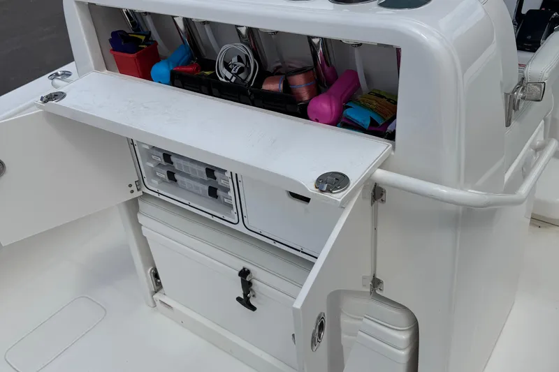  Yacht Photos Pics 2024 SeaVee 32Z boat storage compartment with organized fishing gear and tackle boxes.