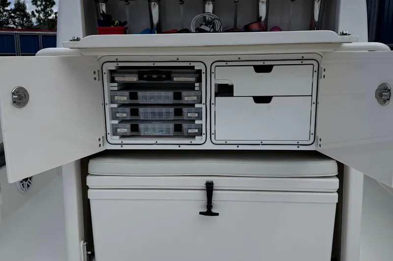  Yacht Photos Pics 2024 SeaVee 32Z boat storage compartments with organized tackle boxes and drawers.
