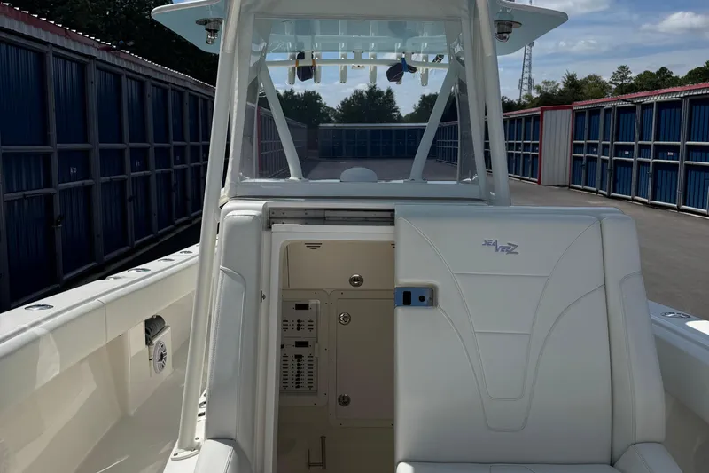  Yacht Photos Pics 2024 SeaVee 32Z boat interior with white seating and storage compartments.