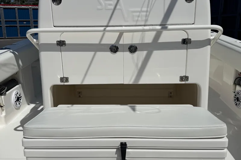  Yacht Photos Pics 2024 SeaVee 32Z boat interior with cushioned seating and storage compartments.