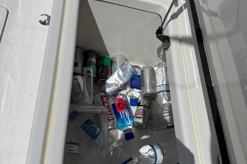  Yacht Photos Pics Cooler on 2024 SeaVee 32Z boat filled with drinks and water bottles.